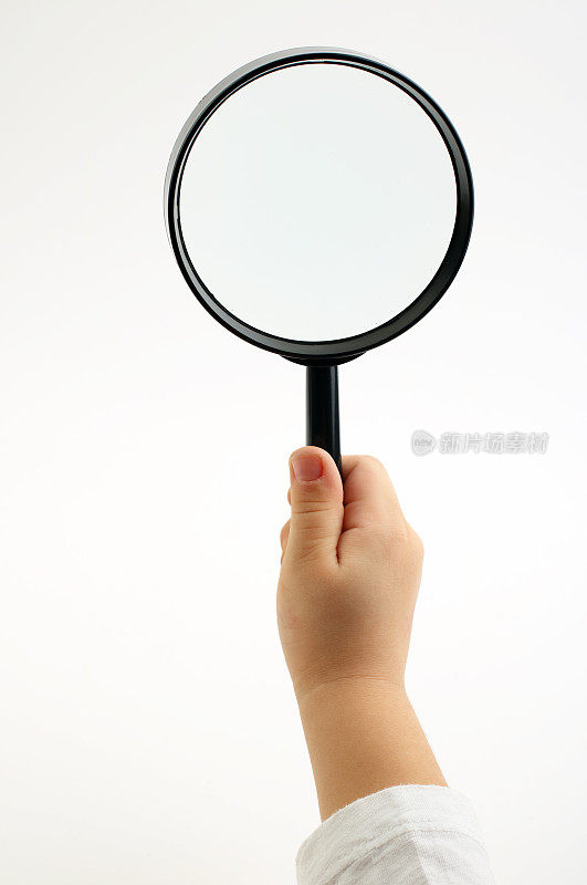 Child  holding magnifying glass